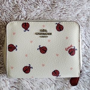 Woman's Coach ladybug small zip around wallet